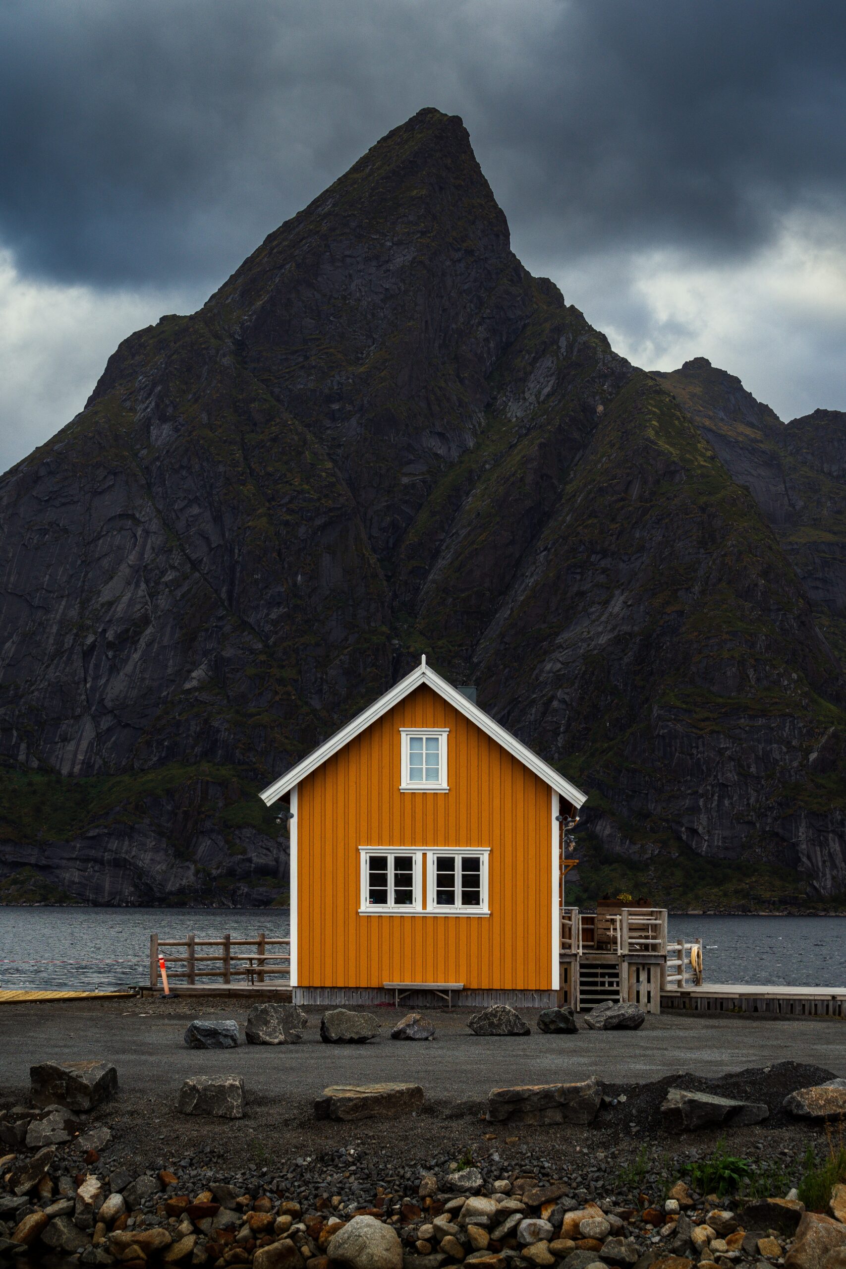 Traditional yellow rorbu cabin in Sakrisoy Lofoten islands for authentic Norway fjord rentals